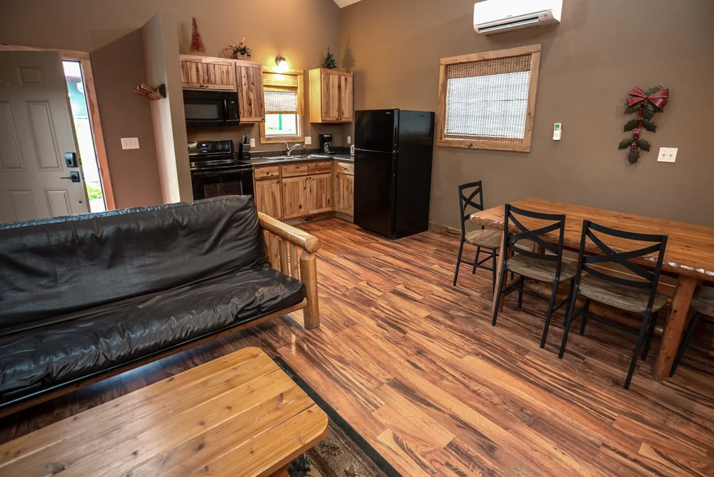 The kitchen and dining area of a Loft Cabin at Santa's Cottages.