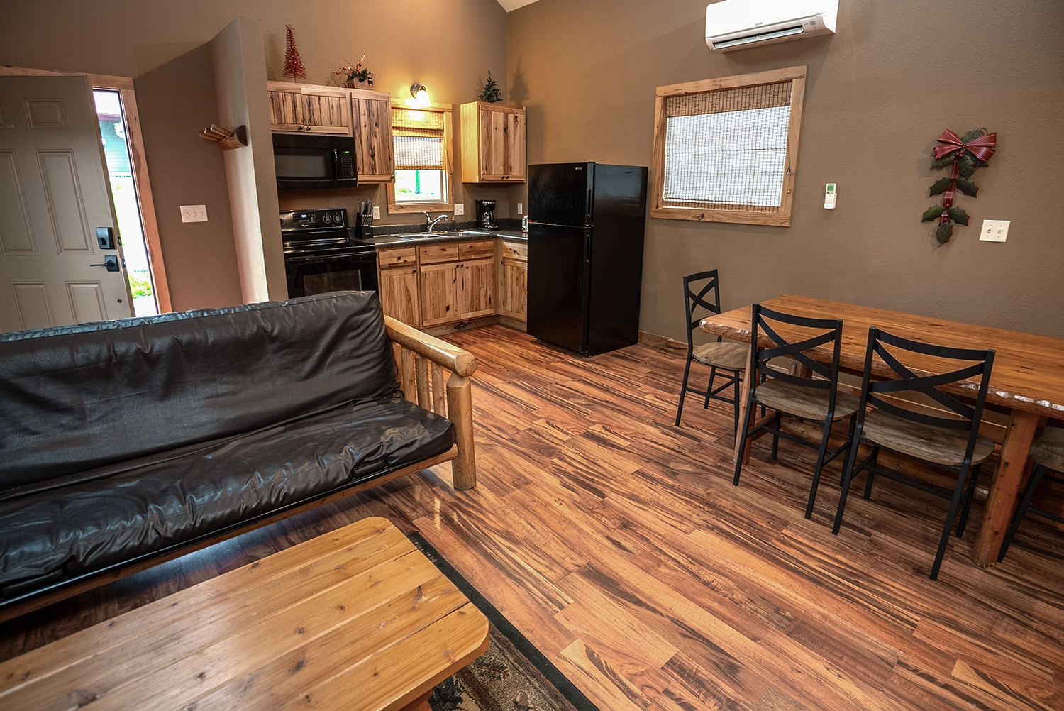 The kitchen and dining area of a Loft Cabin at Santa's Cottages.